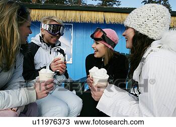 Stock Photo - four women enjoying 
hot drinks. fotosearch 
- search stock 
photos, pictures, 
images, and photo 
clipart