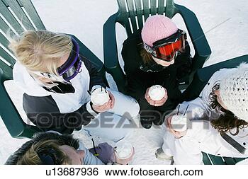 Stock Photo - four women enjoying 
hot drinks. fotosearch 
- search stock 
photos, pictures, 
images, and photo 
clipart