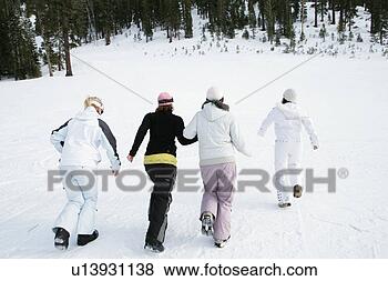 Stock Photo - four women moving 
down hill. fotosearch 
- search stock 
photos, pictures, 
images, and photo 
clipart