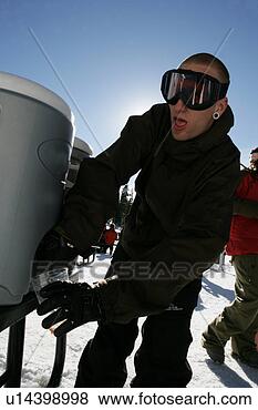 Stock Photo - man getting a 
drink from a cooler. 
fotosearch - search 
stock photos, 
pictures, images, 
and photo clipart