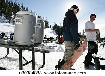 Stock Photo - two men in front 
of a table with 
coolers. fotosearch 
- search stock 
photos, pictures, 
images, and photo 
clipart