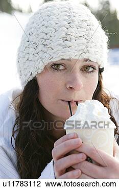 Stock Photo - woman drinking 
a hot drink with 
whip cream. fotosearch 
- search stock 
photos, pictures, 
images, and photo 
clipart
