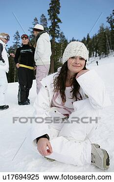 Stock Image - woman sitting 
on ski slope with 
three women in 
background. fotosearch 
- search stock 
photos, pictures, 
images, and photo 
clipart