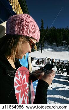 Stock Photo - woman with snowboard 
and cellphone. 
fotosearch - search 
stock photos, 
pictures, images, 
and photo clipart