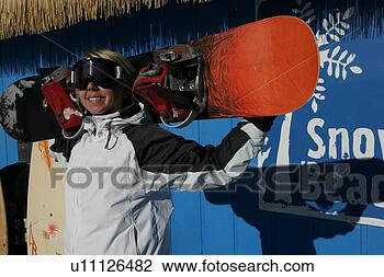 Stock Photo - women with googles 
holding a snowboard. 
fotosearch - search 
stock photos, 
pictures, images, 
and photo clipart