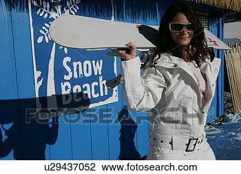 Stock Photo - young woman holding 
a snow board. 
fotosearch - search 
stock photos, 
pictures, images, 
and photo clipart