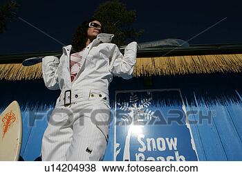 Stock Photo - young woman in 
a white snowsuit. 
fotosearch - search 
stock photos, 
pictures, images, 
and photo clipart