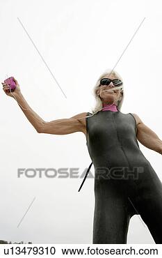 Stock Photography - portrait of a 
mature woman with 
a gadget. fotosearch 
- search stock 
photos, pictures, 
images, and photo 
clipart
