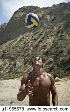 Stock Photo - portrait of a 
young man bouncing 
a ball on his 
head. fotosearch 
- search stock 
photos, pictures, 
images, and photo 
clipart