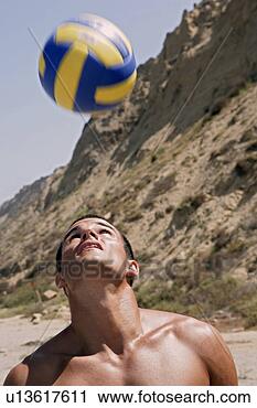 Stock Photography - portrait of a 
young man bouncing 
a ball on his 
head. fotosearch 
- search stock 
photos, pictures, 
images, and photo 
clipart