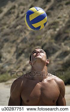 Stock Photography - portrait of a 
young man bouncing 
a ball on his 
head. fotosearch 
- search stock 
photos, pictures, 
images, and photo 
clipart