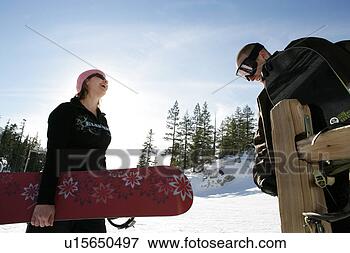 Picture - two people talking 
on a ski slope. 
fotosearch - search 
stock photos, 
pictures, images, 
and photo clipart