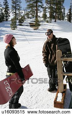 Stock Image - two people talking 
while standing 
on snow slope. 
fotosearch - search 
stock photos, 
pictures, images, 
and photo clipart