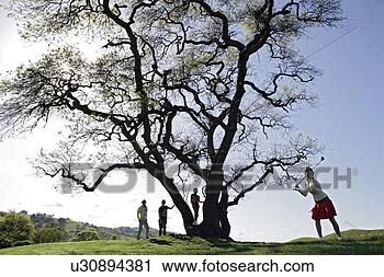 Stock Photography - view of four people 
on a golf course. 
fotosearch - search 
stock photos, 
pictures, images, 
and photo clipart