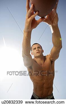 Stock Photograph - view of a man 
diving at a ball. 
fotosearch - search 
stock photos, 
pictures, images, 
and photo clipart