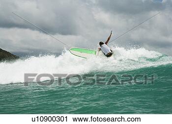 Stock Photography - view of a surfer 
riding the waves. 
fotosearch - search 
stock photos, 
pictures, images, 
and photo clipart