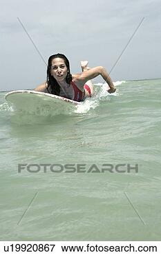 Picture - view of a woman 
surfboarding. 
fotosearch - search 
stock photos, 
pictures, images, 
and photo clipart