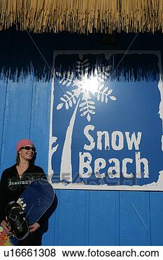 Stock Photo - woman in pink 
hat holding a 
snowboard. fotosearch 
- search stock 
photos, pictures, 
images, and photo 
clipart
