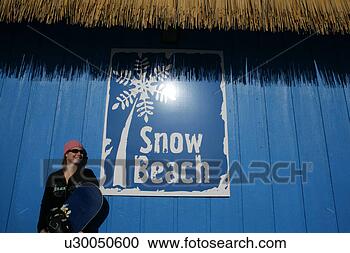 Stock Photography - woman in pink 
hat holding a 
snowboard. fotosearch 
- search stock 
photos, pictures, 
images, and photo 
clipart
