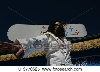 Stock Image - young woman in 
a white snowsuit 
holding a snow 
board. fotosearch 
- search stock 
photos, pictures, 
images, and photo 
clipart