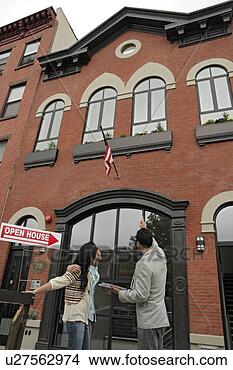 Stock Photo - three people before 
a building, low 
angle view. fotosearch 
- search stock 
photos, pictures, 
images, and photo 
clipart