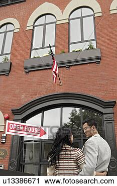 Stock Photography - young couple in 
front of building. 
fotosearch - search 
stock photos, 
pictures, images, 
and photo clipart