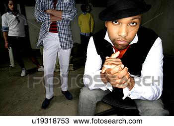 Stock Photo - group of men standing 
in an open space. 
fotosearch - search 
stock photos, 
pictures, images, 
and photo clipart