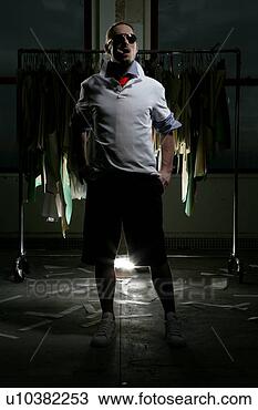 Stock Photo - man wearing shades 
with his hands 
in his pockets. 
fotosearch - search 
stock photos, 
pictures, images, 
and photo clipart