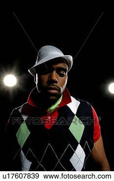 Stock Photograph - young african-american 
man wearing a 
stylish hat. fotosearch 
- search stock 
photos, pictures, 
images, and photo 
clipart