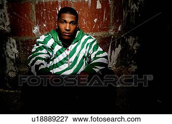 Picture - young african-american 
man sitting down. 
fotosearch - search 
stock photos, 
pictures, images, 
and photo clipart