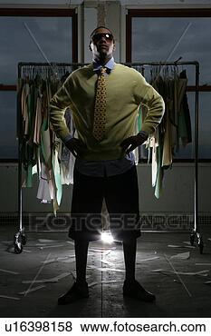 Stock Photo - young man with 
his hands on his 
hips wearing shades. 
fotosearch - search 
stock photos, 
pictures, images, 
and photo clipart