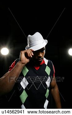 Stock Photography - young man tipping 
his hat. fotosearch 
- search stock 
photos, pictures, 
images, and photo 
clipart