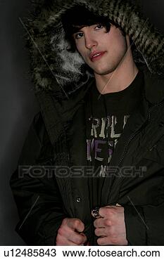 Stock Photo - young man wearing 
a hooded jacket. 
fotosearch - search 
stock photos, 
pictures, images, 
and photo clipart