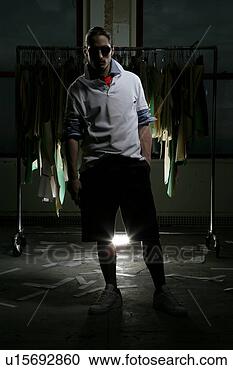 Stock Photography - young man wearing 
shades indoors. 
fotosearch - search 
stock photos, 
pictures, images, 
and photo clipart