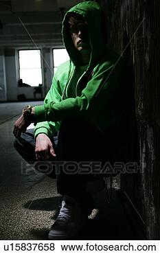 Stock Photo - young man wearing 
a hooded sweatshirt. 
fotosearch - search 
stock photos, 
pictures, images, 
and photo clipart