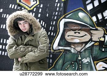 Stock Photograph - view of a man 
near a graffiti. 
fotosearch - search 
stock photos, 
pictures, images, 
and photo clipart