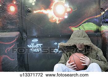 Stock Photo - view of a man 
holding a ball. 
fotosearch - search 
stock photos, 
pictures, images, 
and photo clipart