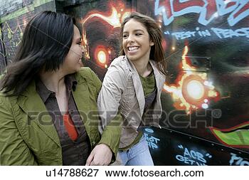 Picture - view of two happily 
women. fotosearch 
- search stock 
photos, pictures, 
images, and photo 
clipart