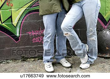 Stock Photograph - view of a two 
people near a 
wall. fotosearch 
- search stock 
photos, pictures, 
images, and photo 
clipart