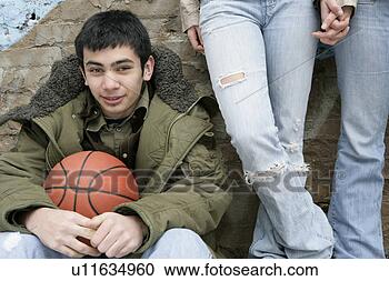 Stock Photography - view of a young 
man with a basketball. 
fotosearch - search 
stock photos, 
pictures, images, 
and photo clipart