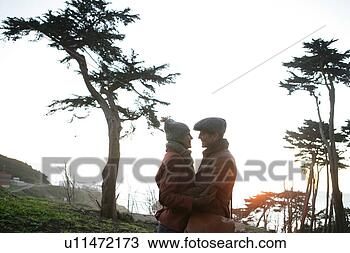 Stock Photo - mature couple 
holding each other. 
fotosearch - search 
stock photos, 
pictures, images, 
and photo clipart