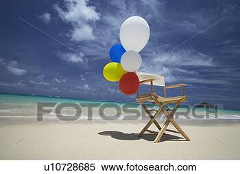 Stock Image - view of air balloons 
on wooden chair 
at beach. fotosearch 
- search stock 
photos, pictures, 
images, and photo 
clipart