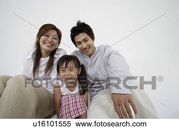 Stock Image - a young couple 
with a girl. fotosearch 
- search stock 
photos, pictures, 
images, and photo 
clipart