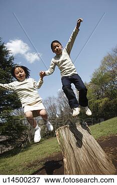 Picture - children jumping 
from wooden log. 
fotosearch - search 
stock photos, 
pictures, images, 
and photo clipart