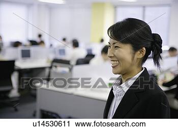 Stock Photography - a ecstatic view 
of woman in the 
office. fotosearch 
- search stock 
photos, pictures, 
images, and photo 
clipart