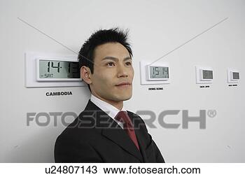 Stock Photo - businessman with 
time zones, portrait. 
fotosearch - search 
stock photos, 
pictures, images, 
and photo clipart