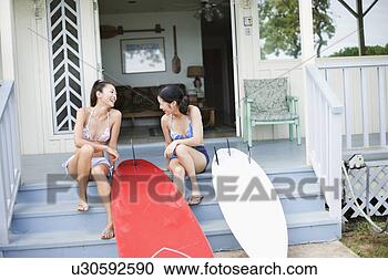 Stock Photography - young women sitting 
on stairs laughing. 
fotosearch - search 
stock photos, 
pictures, images, 
and photo clipart