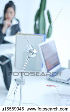 Stock Image - notebook computer 
with a young woman 
in the background. 
fotosearch - search 
stock photos, 
pictures, images, 
and photo clipart