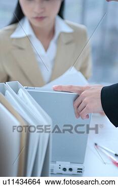 Stock Photo - two young women 
working in office. 
fotosearch - search 
stock photos, 
pictures, images, 
and photo clipart