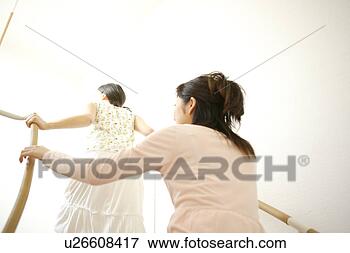 Picture - two young women 
going up stairs. 
fotosearch - search 
stock photos, 
pictures, images, 
and photo clipart